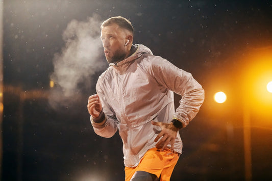 man running outdoors at night, fueled by the best fat burner for men